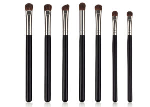 Wholesale 7-piece private label eye makeup brush set featuring synthetic bristles and black wood handles